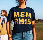 Product Description: Celebrate Memphis' riverfront with this Mud Island Summer Tee. This go-to shirt has a crew neck, short sleeves, and unique type and graphic treatment on the chest.</br></br>– Solid color tee</br></br>– Orange "Memphis" type with white illustrativegraphics</br></br>– Crew neck</br></br>– Short sleeves</br></br>– Machine washable</br> Mud Island Summer Tee